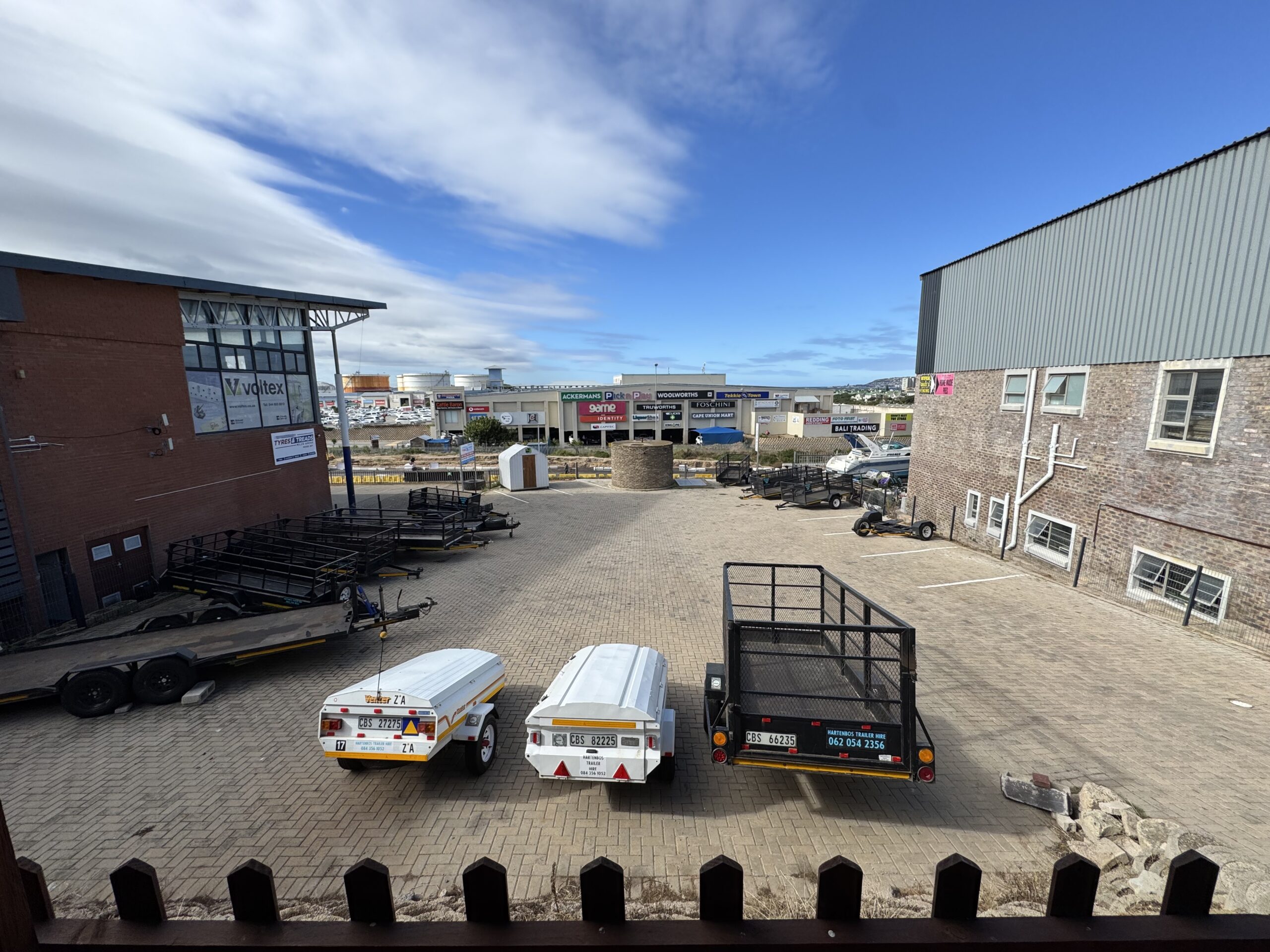 The trailer yard with Langeberg Mall across Louis Fourie Road